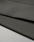 An olive green fabric with a smooth texture features a subtle inscription of 'MIND BODY HEART SOUL', highlighting a wellness theme.