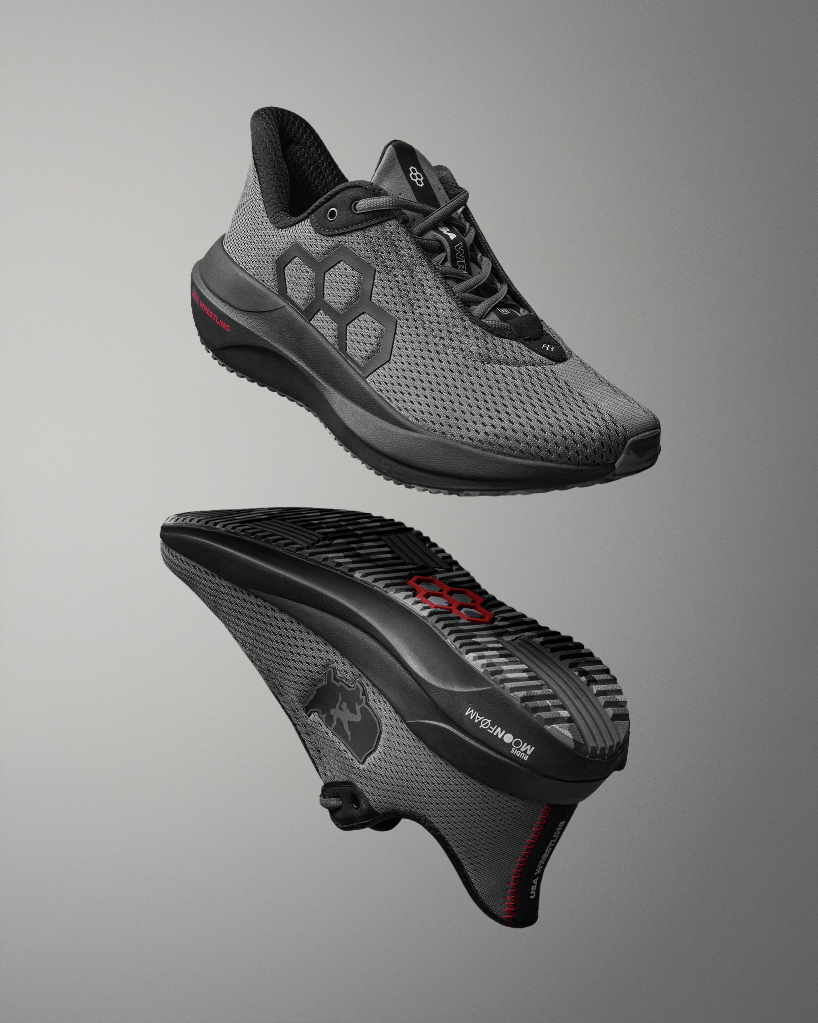 Gray athletic shoe with black sole on a gray background