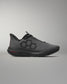 Gray athletic shoe with black accents on a gray background
