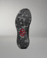 Camouflage-patterned shoe sole with a red hexagonal logo on a gray background