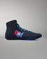 Black wrestling shoe with a red, white, and blue logo on a gray background