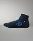 Black wrestling shoe with blue accents on a gray background