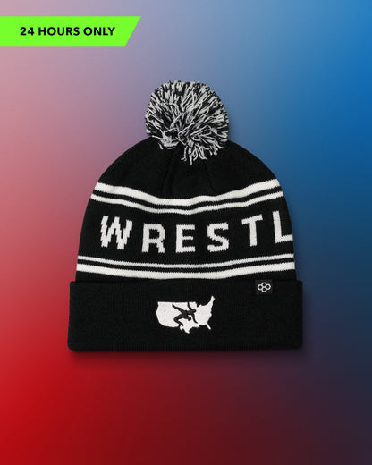 Black USA Wrestling Logo beanie with white text and pom-pom on a gradient background