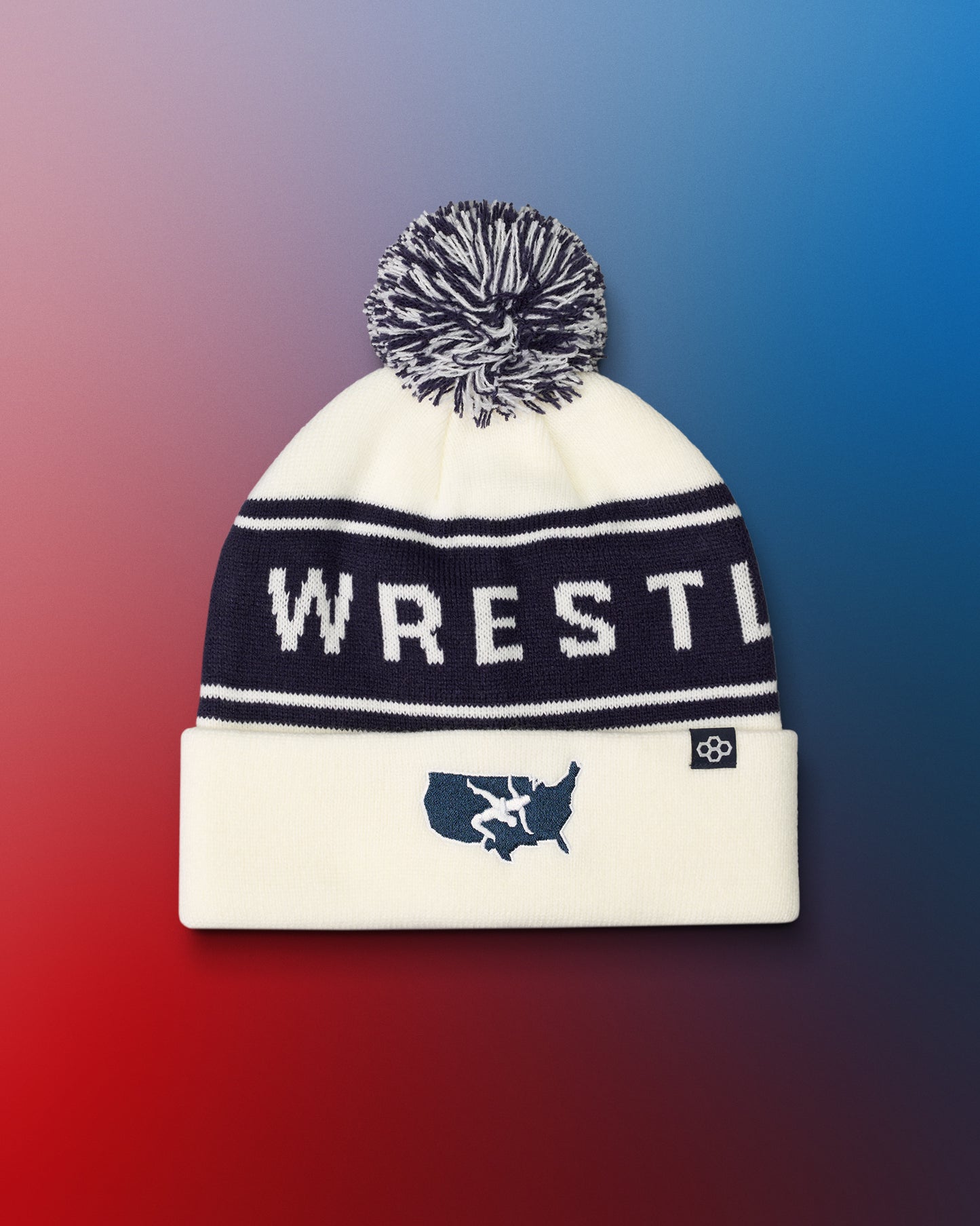 USA Wrestling Logo - White beanie with 'WRESTLE' text and pom-pom on a gradient background