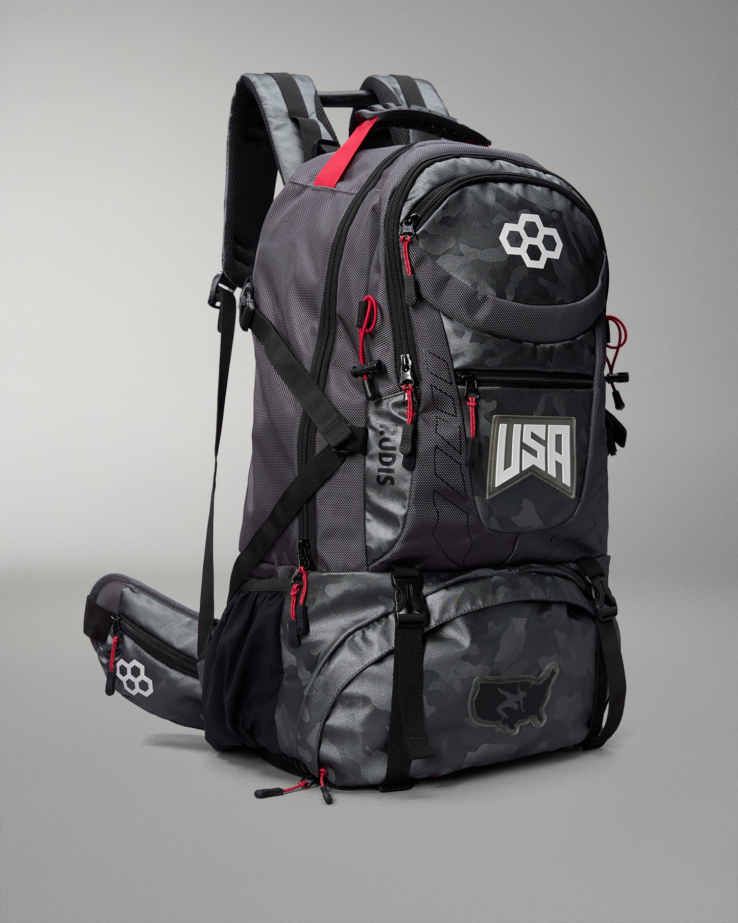 Gray Camo backpack with red accents and USA logo on a gray background