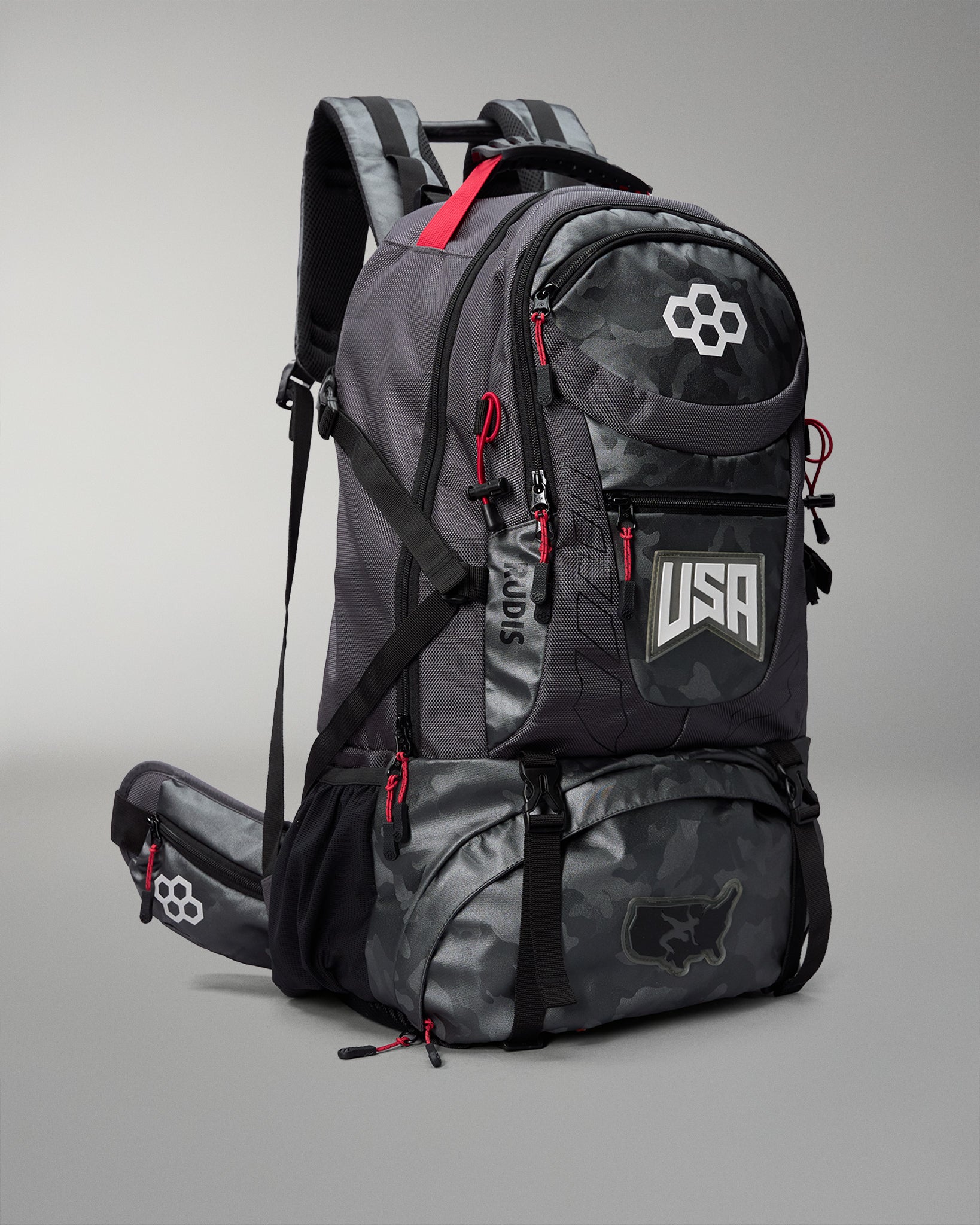 Gray Camo backpack with red accents and USA logo on a gray background