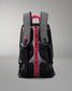 Backpack with visible branding on straps against a gray background