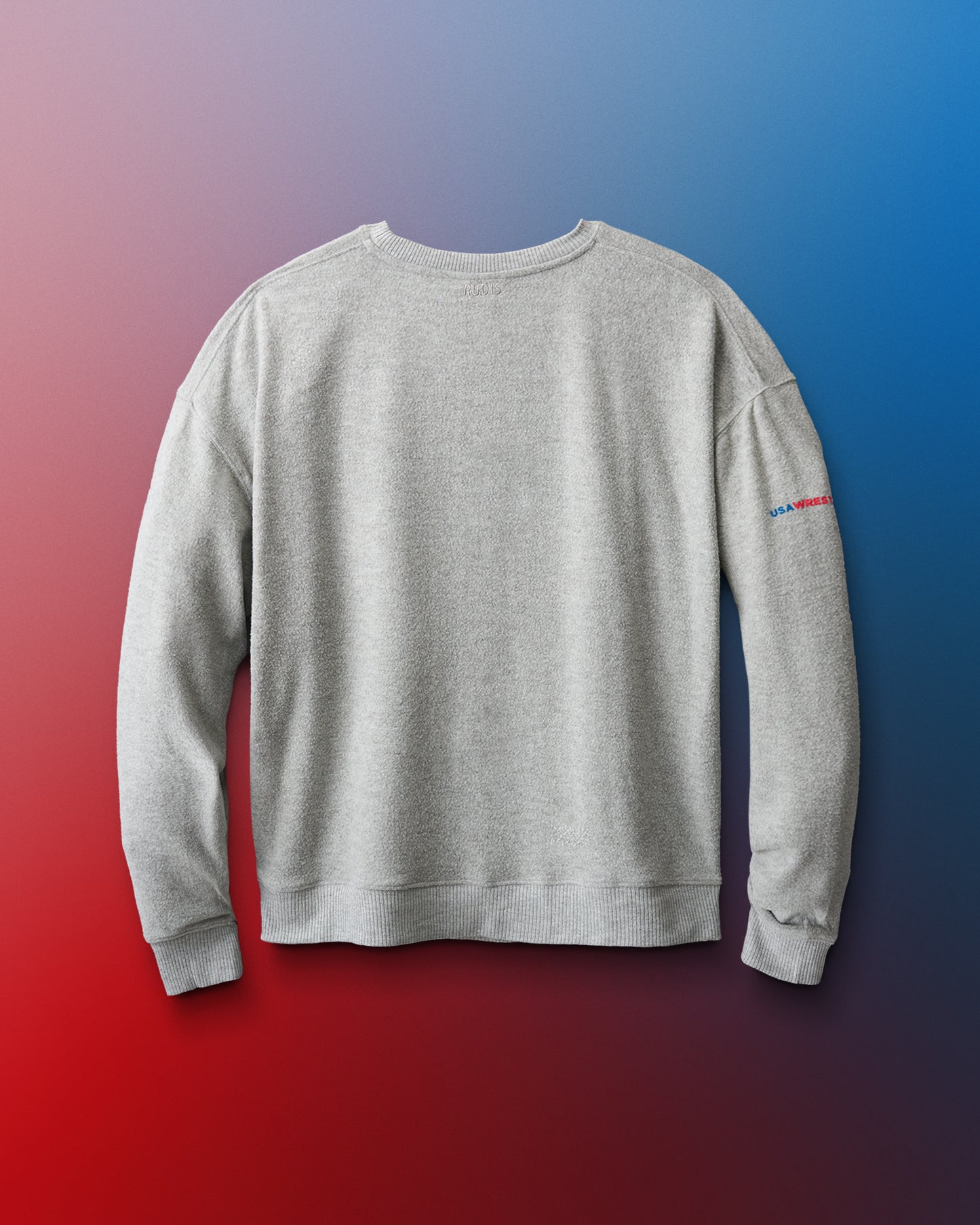 Gray sweatshirt with a small logo on the sleeve against a gradient background