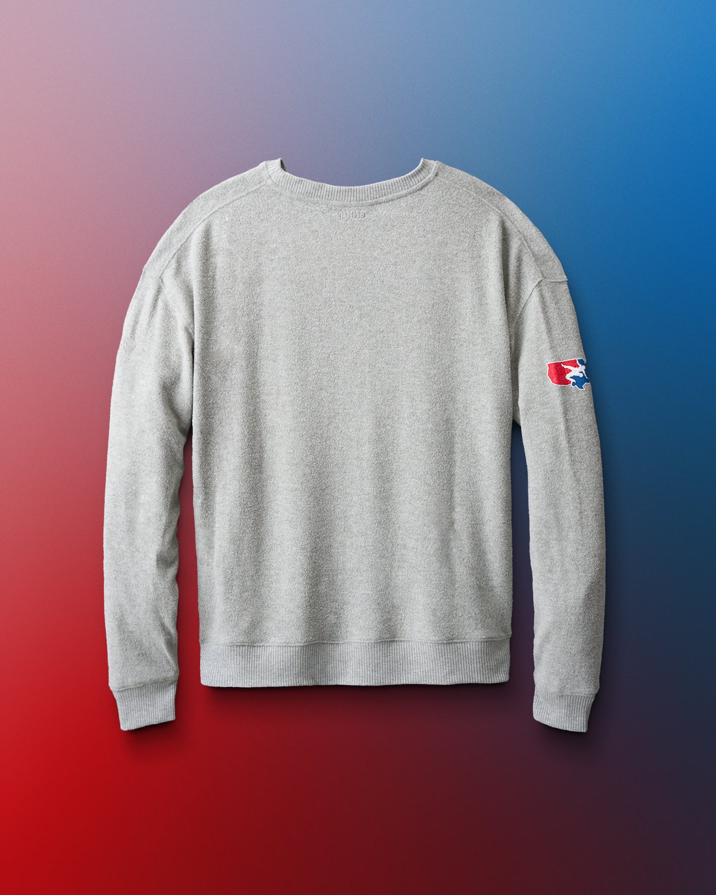 Gray sweatshirt with a logo on the sleeve against a gradient background