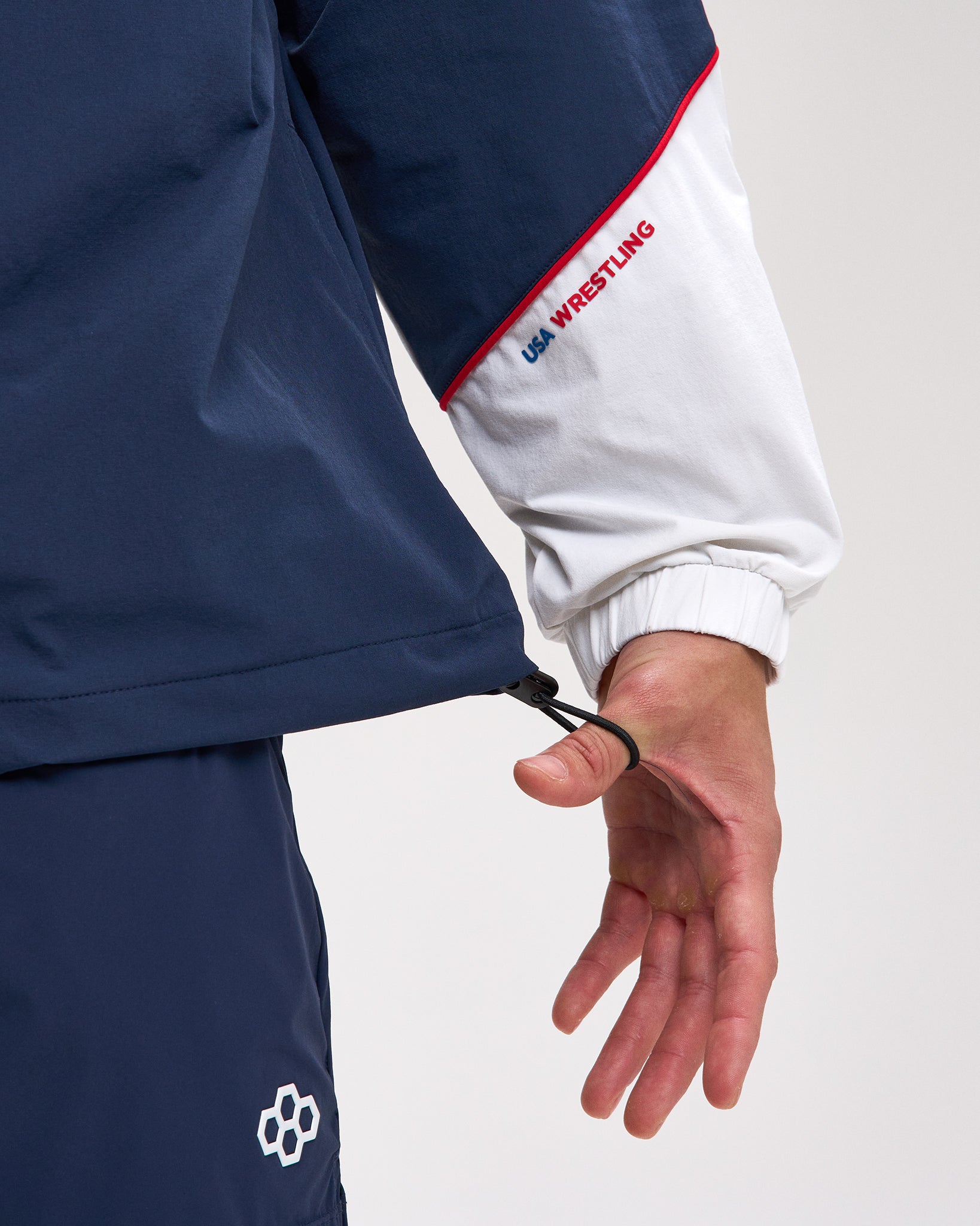 Navy and white wrestling uniform with USA Wrestling logo on a light gray background