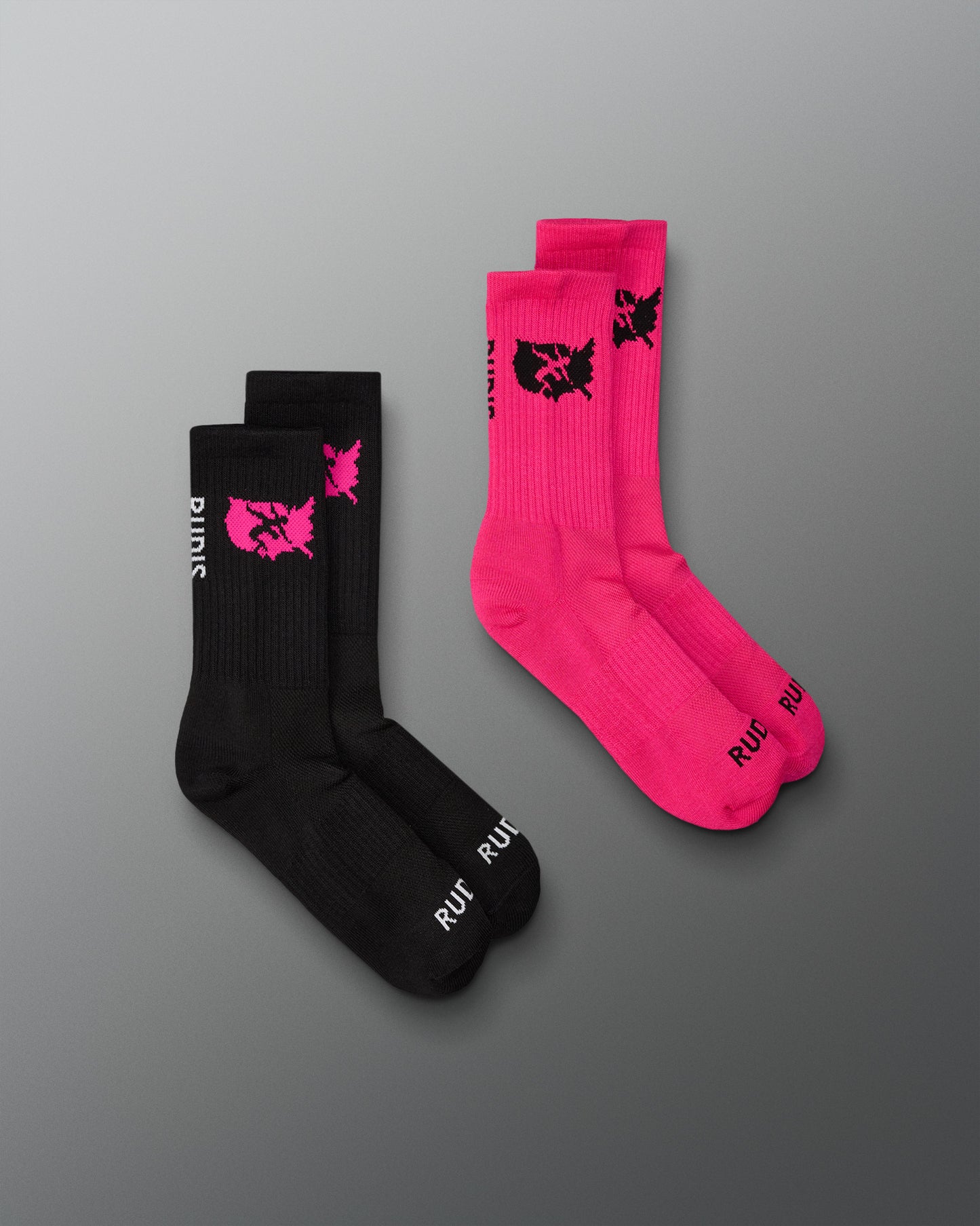 Two pairs of socks, one black and one pink, with a logo on a gray background.