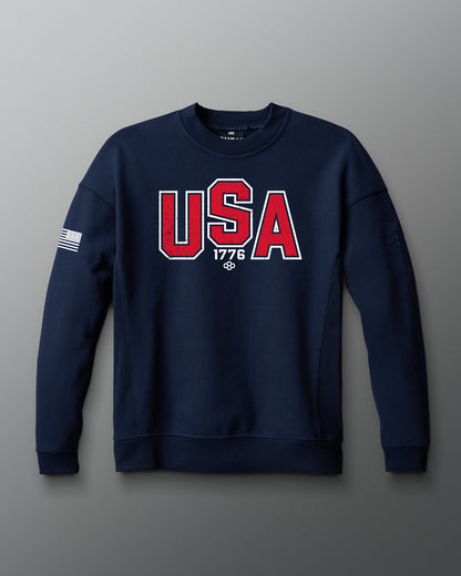 Navy blue sweatshirt with 'USA 1776' text on a gray background