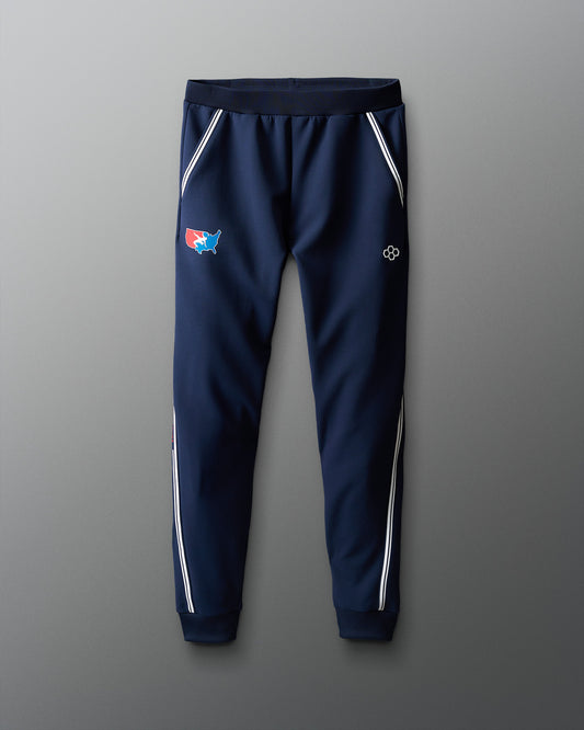 Navy blue jogger pants with white accents on a gradient red to blue background