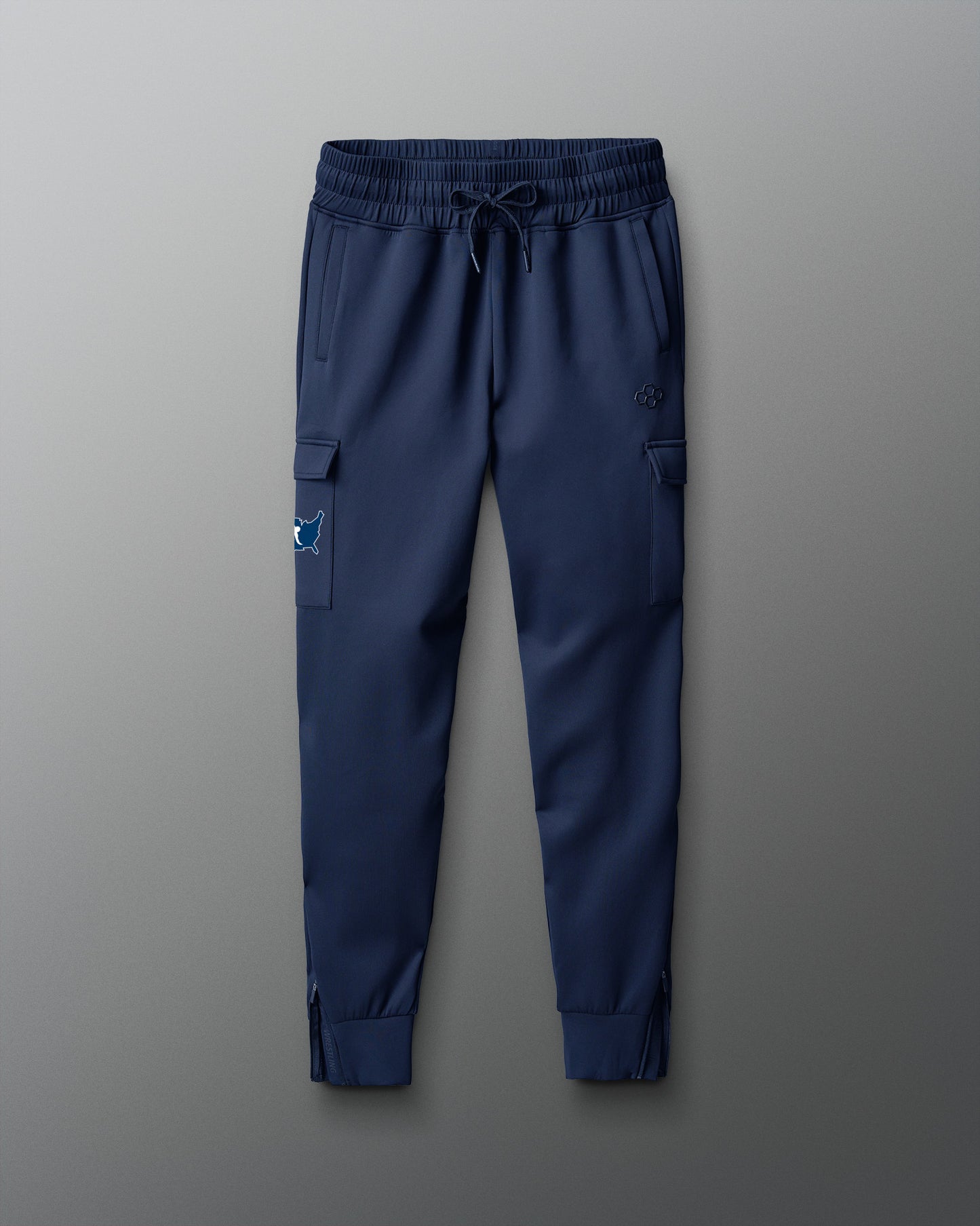 Blue cargo jogger pants on a gray background