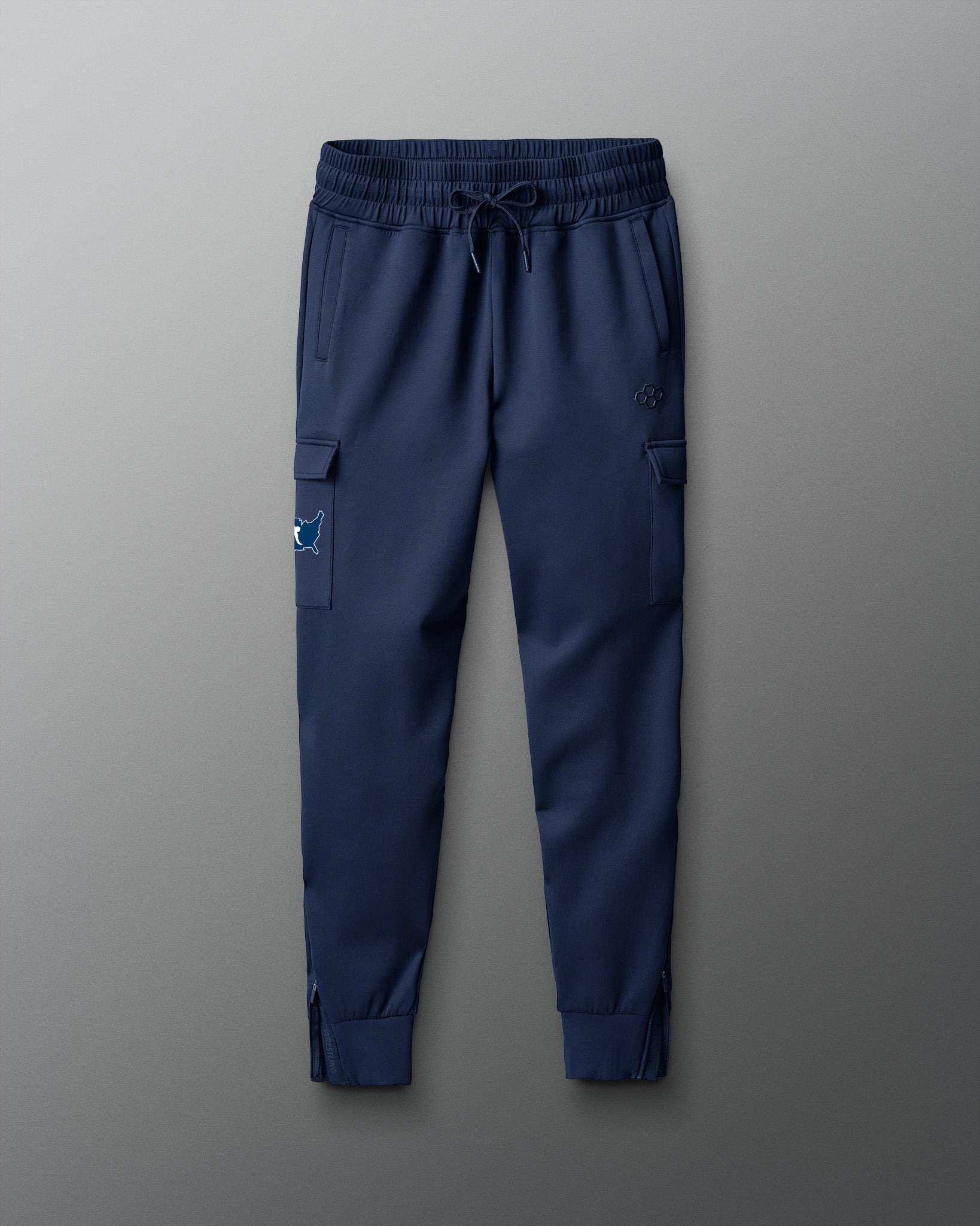 Blue cargo jogger pants on a gray background