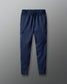 Blue cargo jogger pants on a gray background