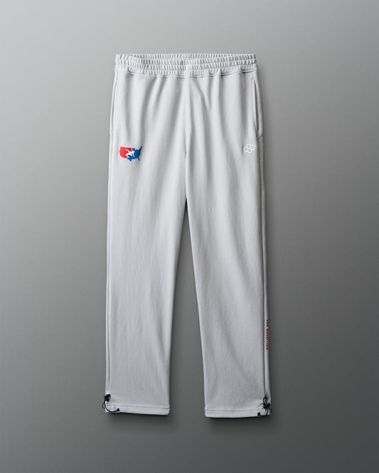 White pants with logos on a gray background