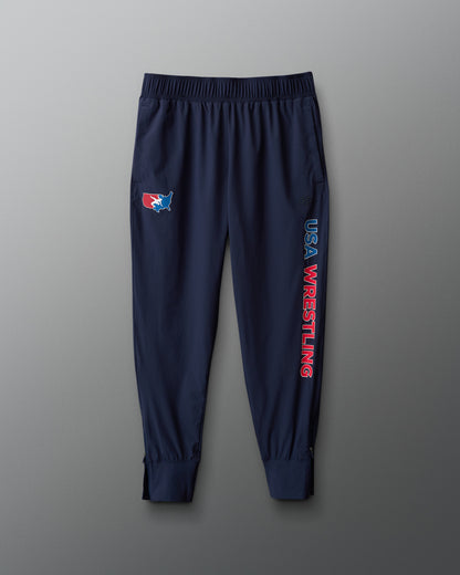 Navy blue sweatpants with USA Wrestling logo and text on a gray background