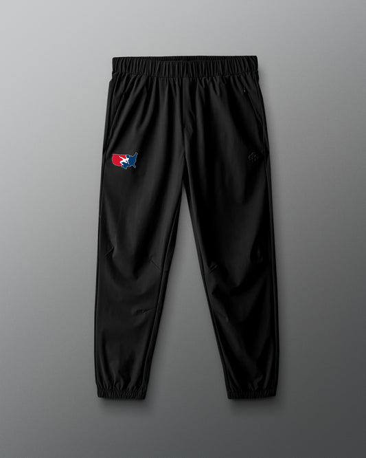 Black pants with a logo on a gray background