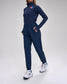 Person wearing a navy tracksuit with a 'USA Wrestling' logo on a white background