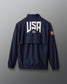 Navy blue jacket with 'USA' logo on the back against a gray background