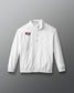 White jacket with a USA Wrestling logo on a gradient blue to red background