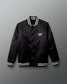 Black jacket with a USA Wrestling logo on a gradient background