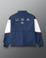 Back view of the RUDIS USA Wrestling Full Zip Movement Podium Jacket in navy, featuring large USA lettering, USA Wrestling logo, white sleeve panels, and red piping.