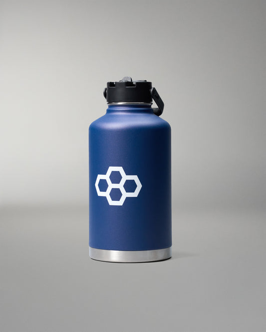 Navy blue water bottle with a white logo on a gray background