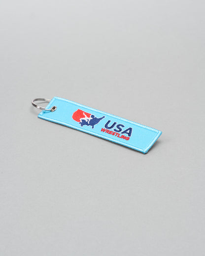 USA Wrestling keychain on a gray background