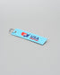 USA Wrestling keychain on a gray background