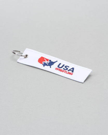 USA Wrestling keychain on a gray background