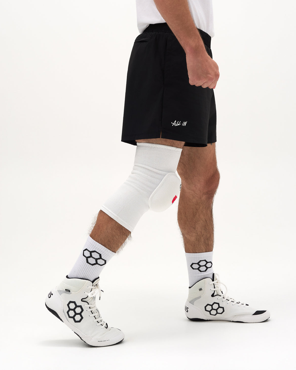 Side view of RUDIS USA Wrestling Map Cushion Knee Pad in white showing the protective knee cushioning and sleeve fit.