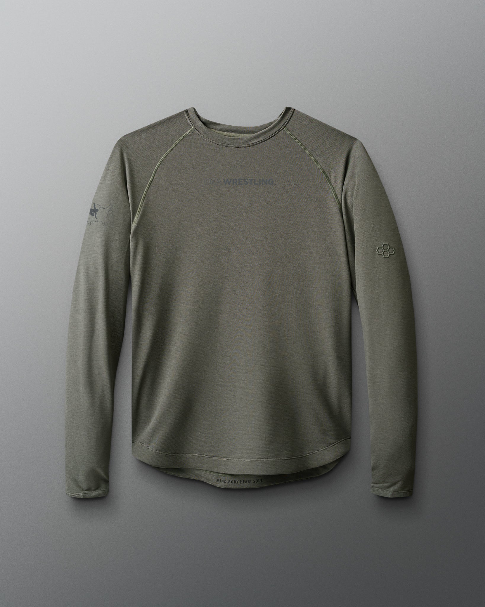 Green long-sleeve shirt with branding on a gray background