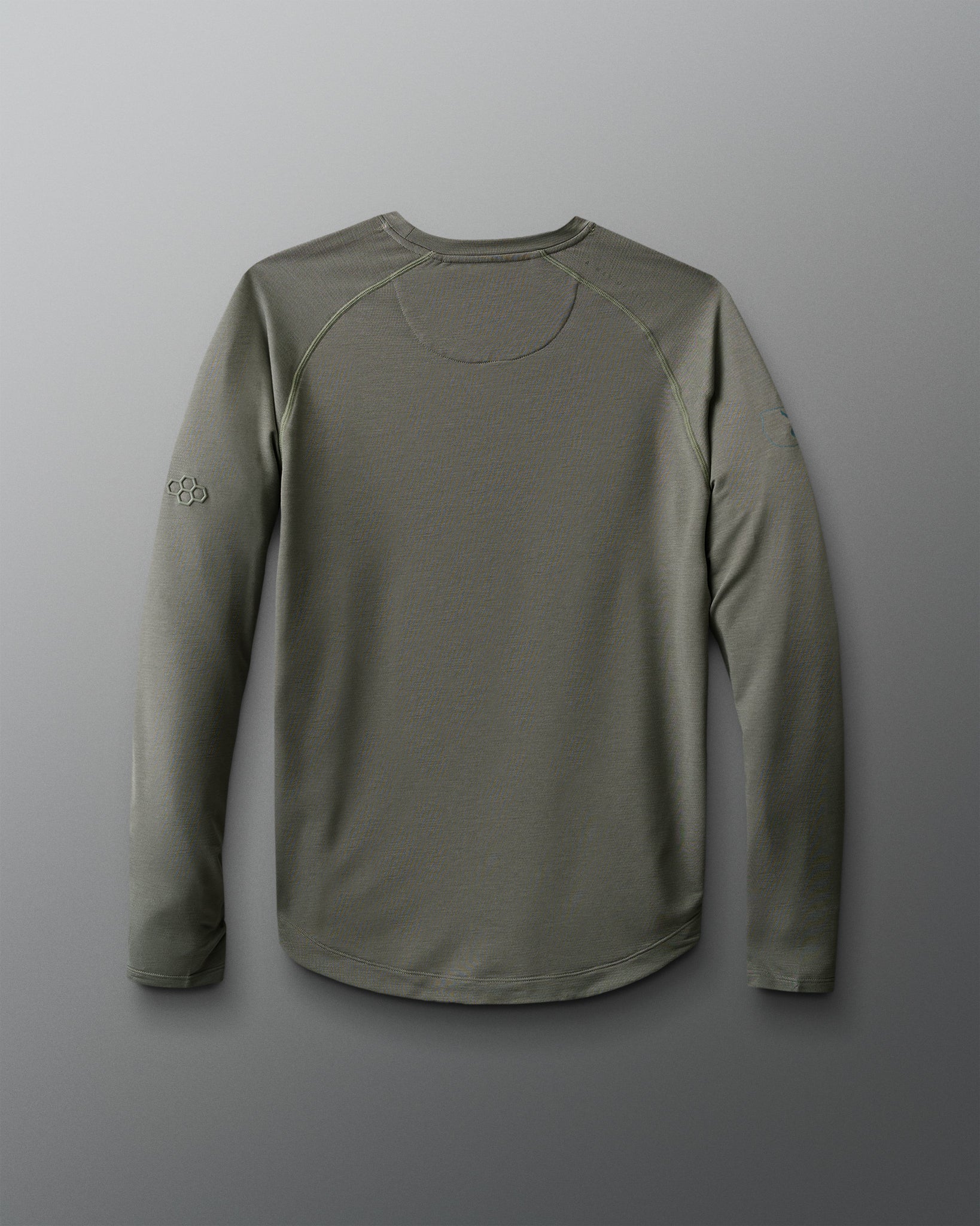 Green long-sleeve shirt on a gray background