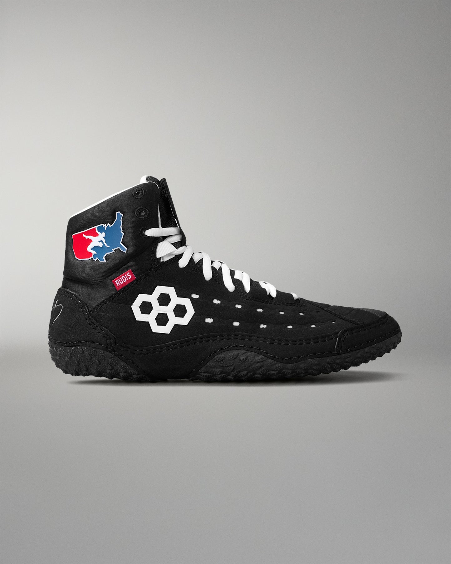 Black wrestling shoe with brand logo on a gray background