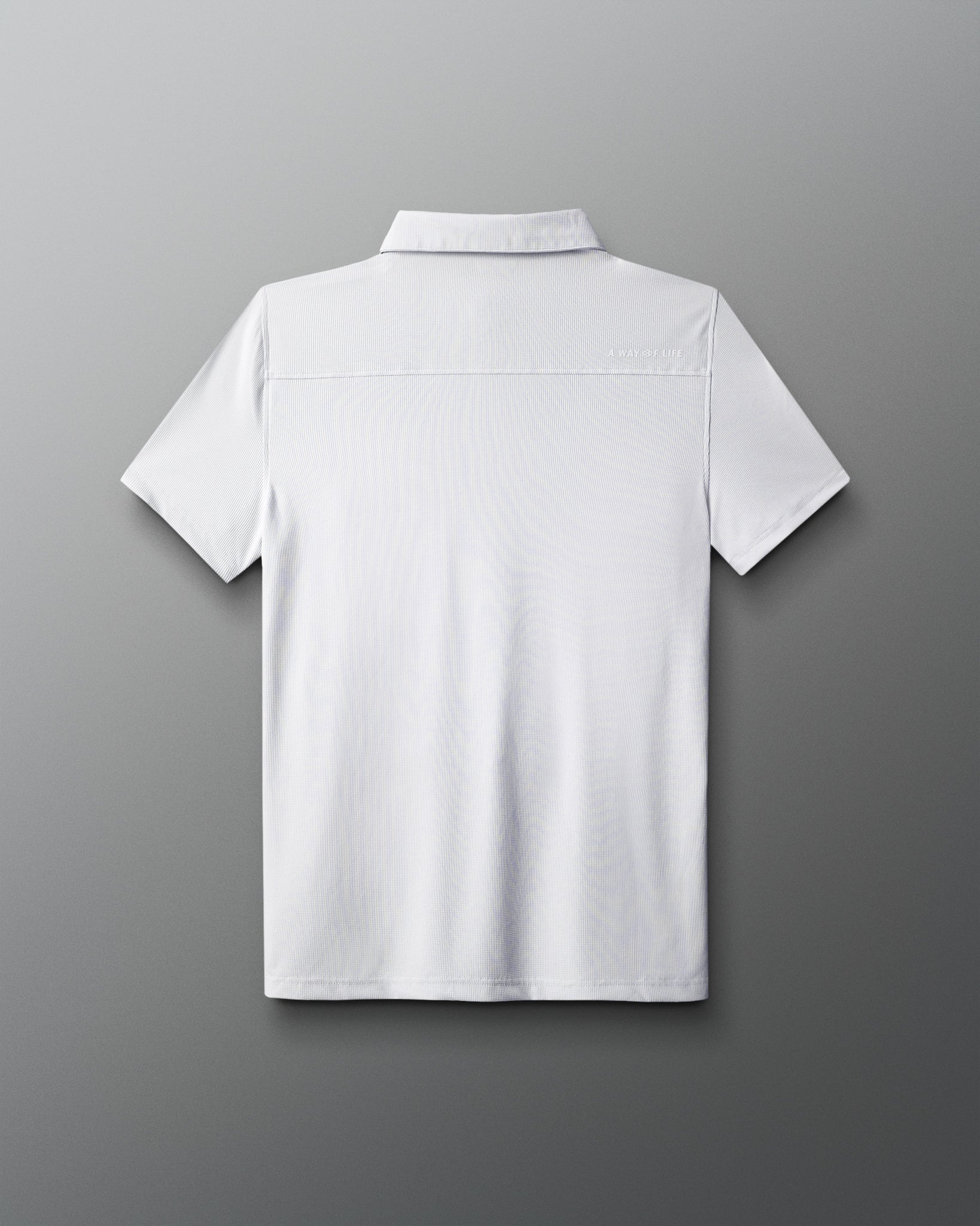 back of white polo shirt