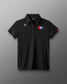 Black polo shirt with logos on a gray background