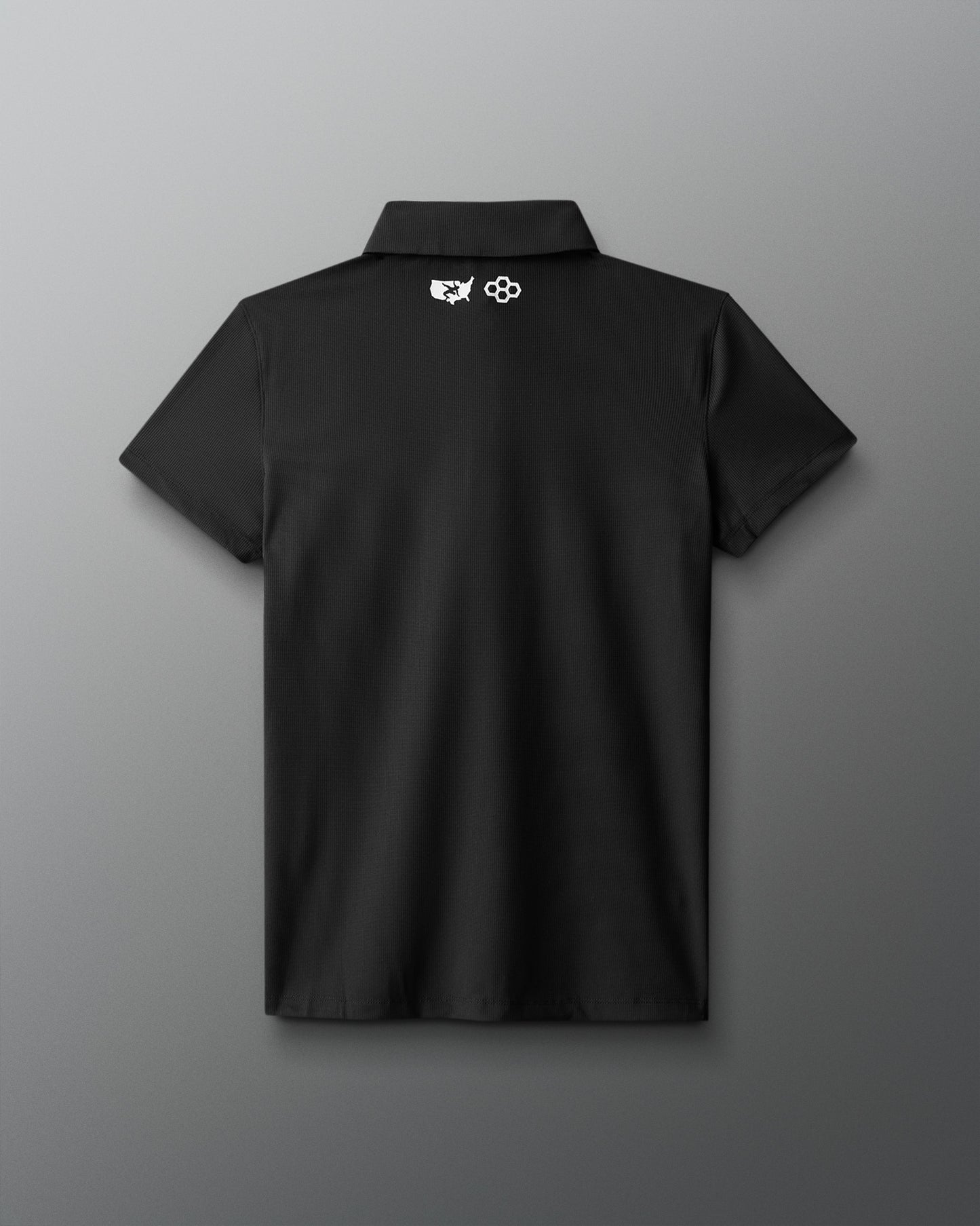 Black polo shirt with a logo on the back against a gray background