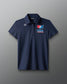 Navy blue polo shirt with USA logo on a gray background