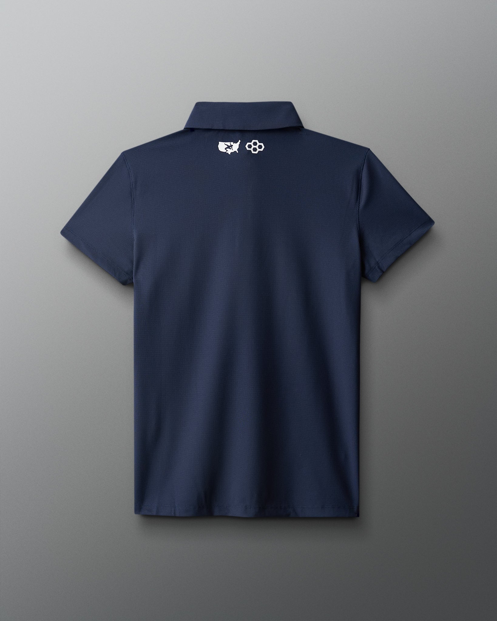 Navy blue polo shirt with a logo on the back against a gray background
