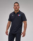 Man wearing a navy polo shirt with 'USA Wrestling' and 'RUDIS' logos on a gray background