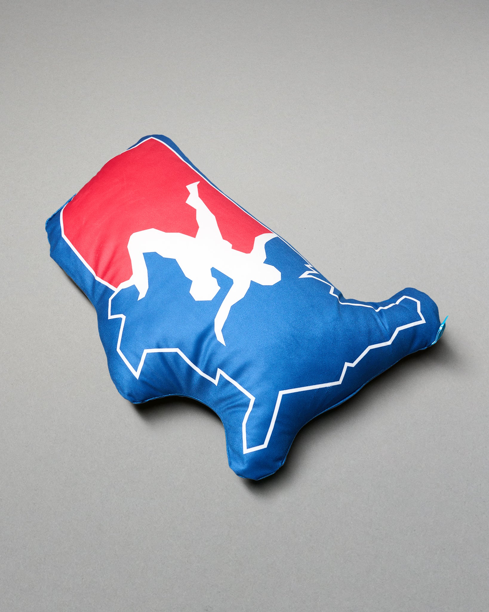 Pillow with a red and blue design on a gray background