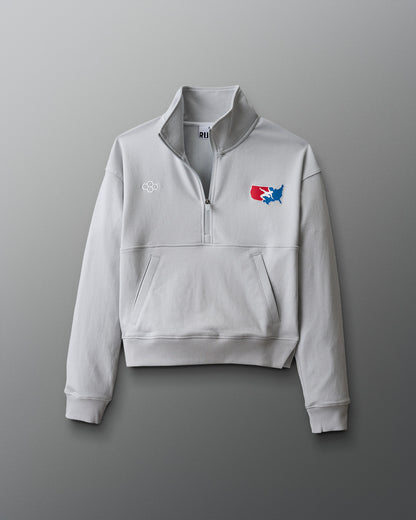 Gray sweatshirt with a logo on a gradient red to blue background