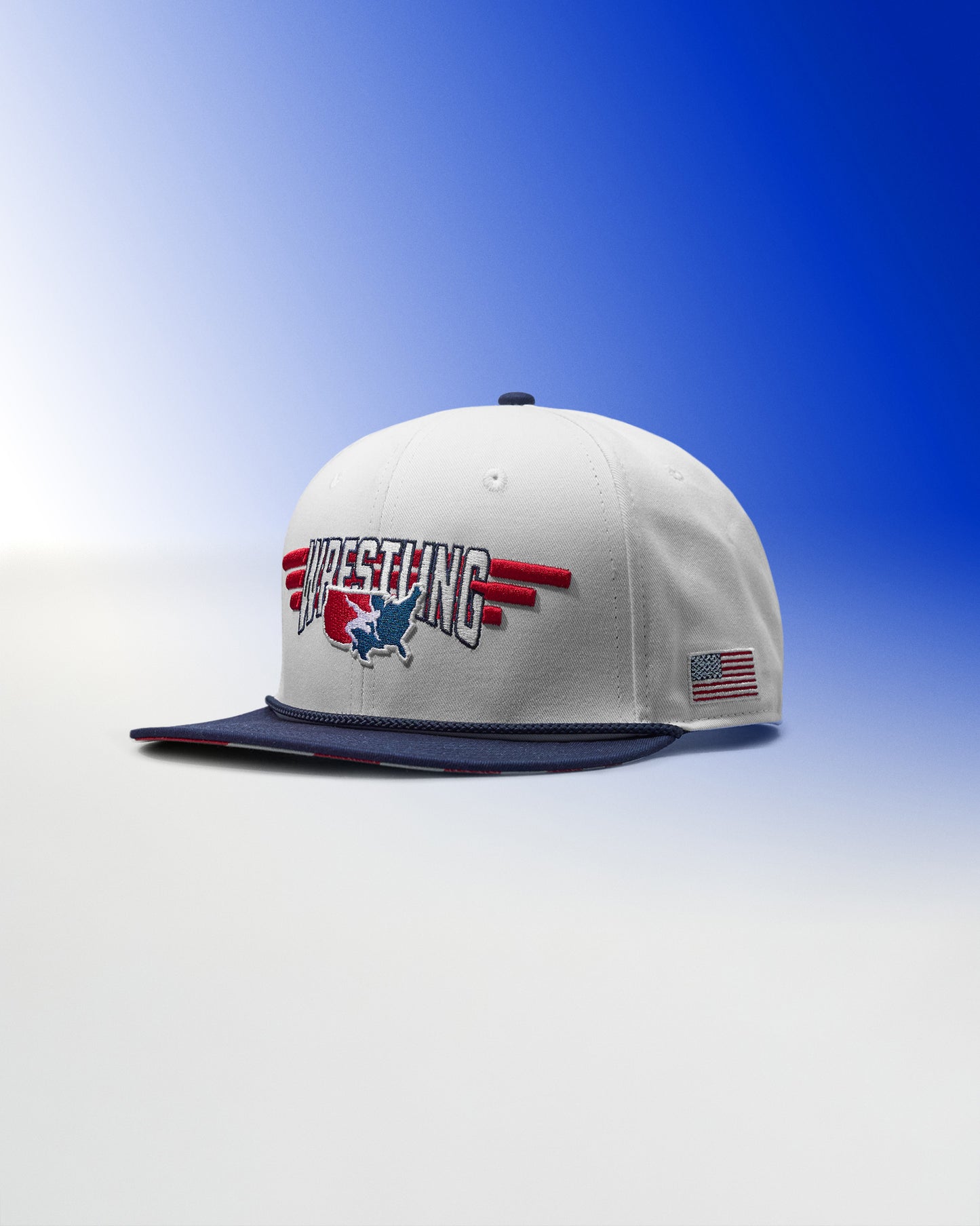 White cap with 'Wrestling' logo and American flag on a blue gradient background