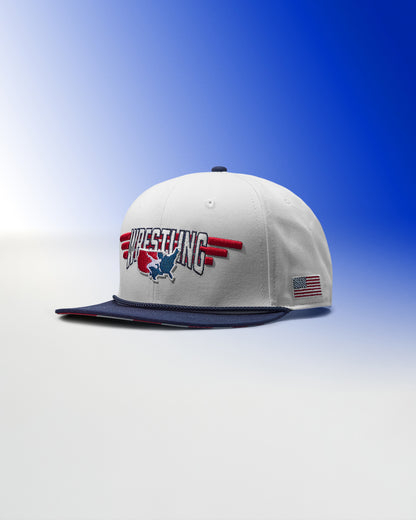White cap with 'Wrestling' logo and American flag on a blue gradient background