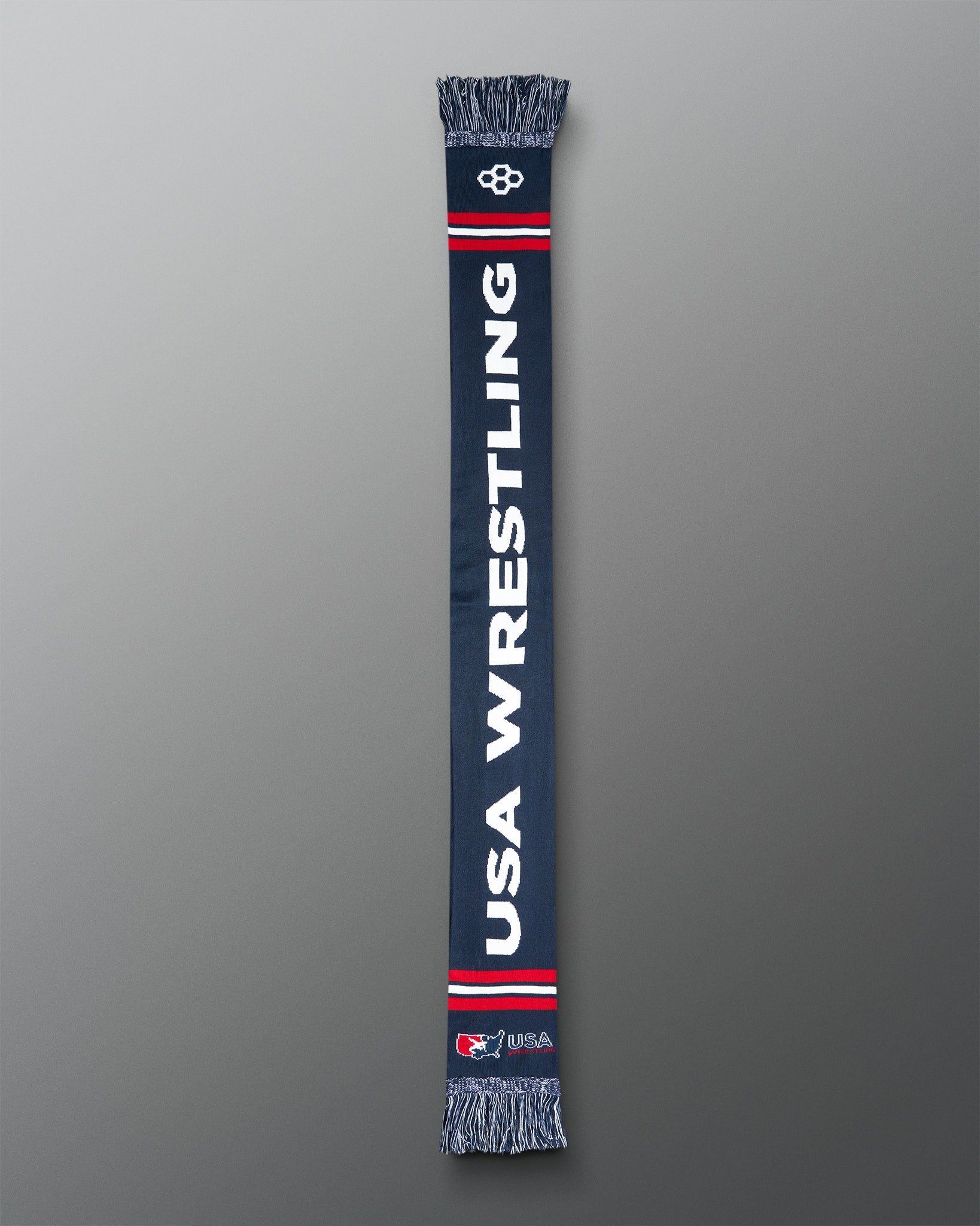 Navy blue scarf with 'USA Wrestling' text on a gray background
