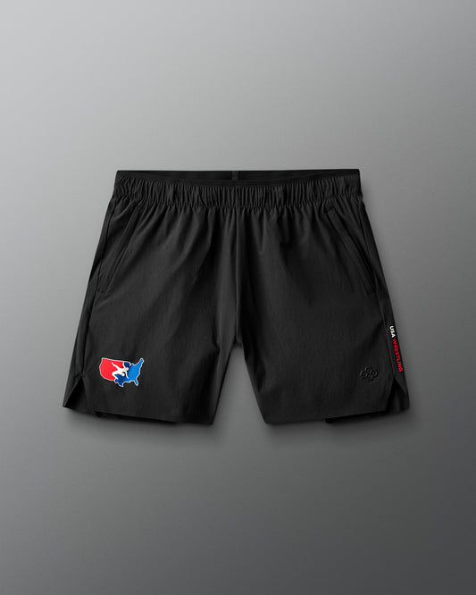 Black shorts with a USA Wrestling logo on a gray background