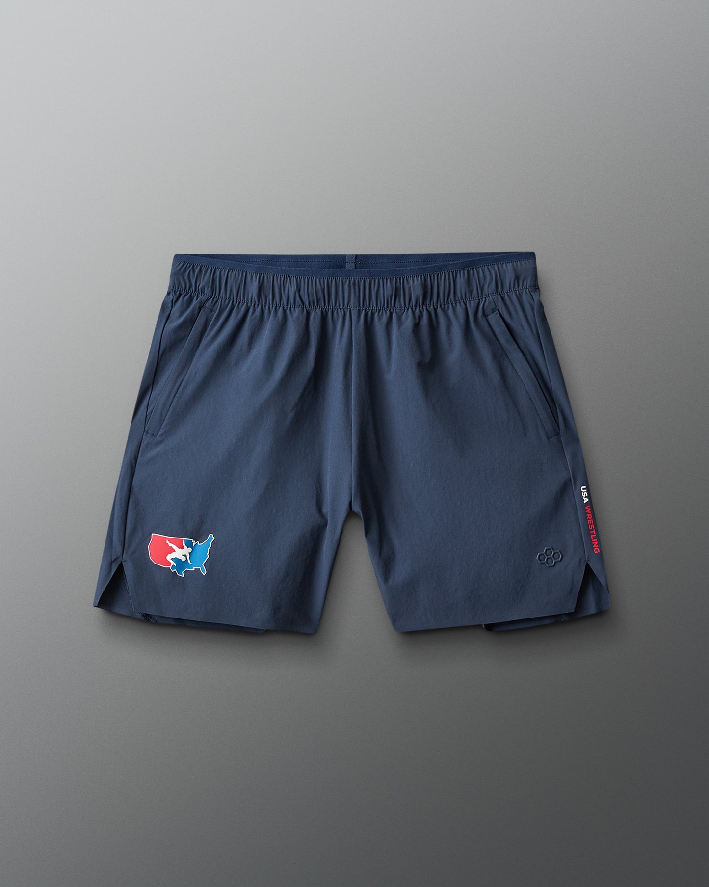Blue athletic shorts with a USA Wrestling logo on a gray background