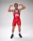 A man posing in a red and blue USA wrestling singlet, flexing his biceps against a light gray studio background.